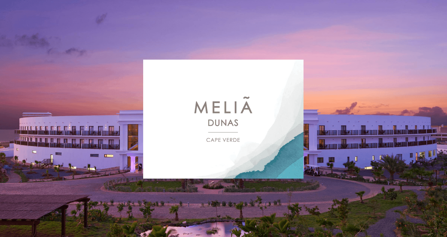 Melia Dunas resort in Cape Verde with a curved white building at sunset.