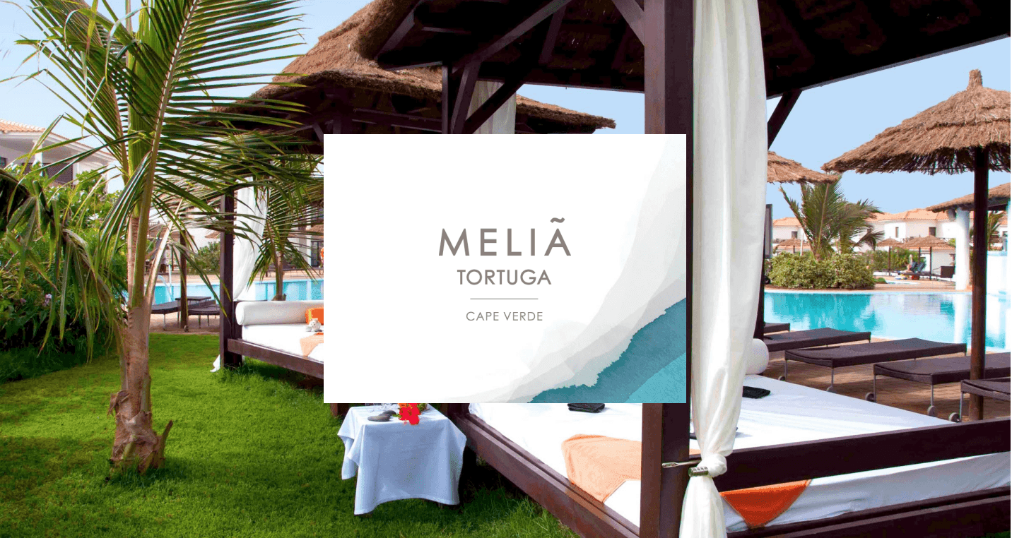 Outdoor lounging area with cabanas and a pool at Melia Tortuga, Cape Verde.