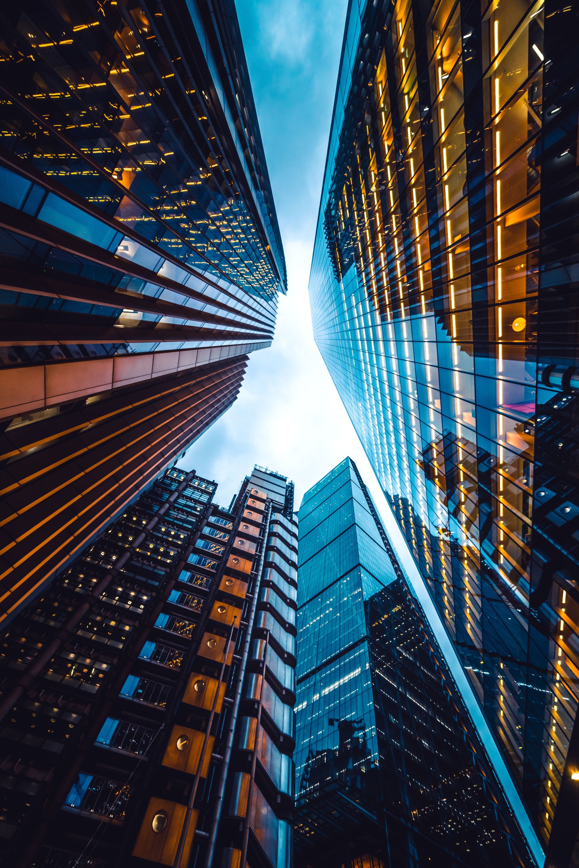 Looking directly up at the skyline of the financial district in central London